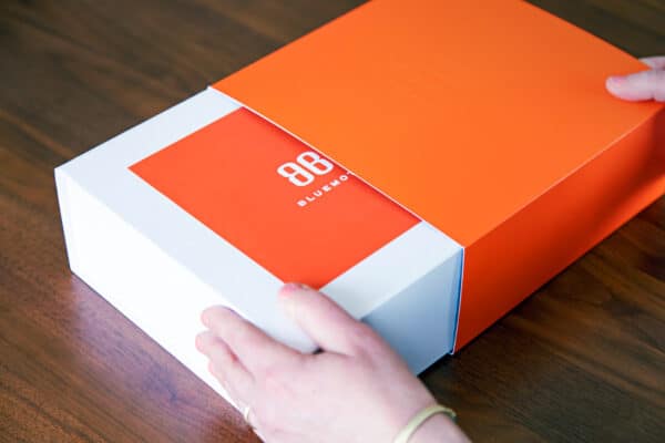 Unboxing a hearing aid package.